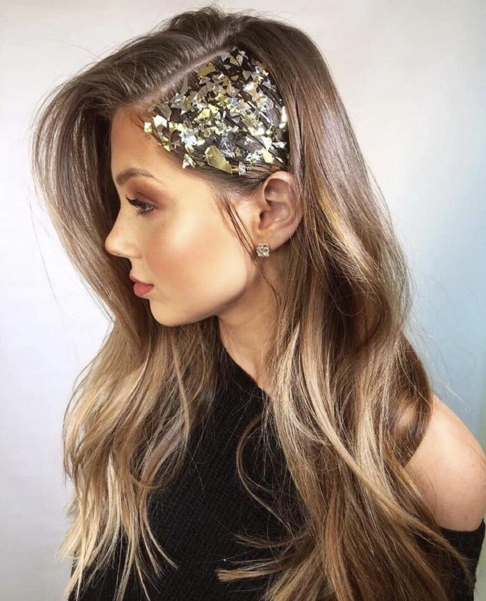 Side swept curls styled for an asymmetric New Year's Eve dress