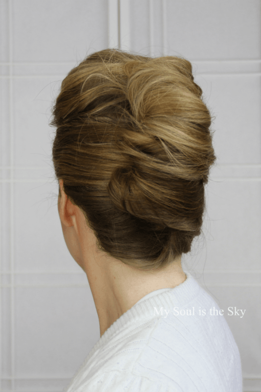 Party French twist updo hairstyle perfect for formal gowns Elegant French twist updo paired with a formal gown for a party look