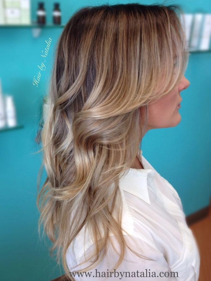 Party-ready balayage color melt hairstyle with soft waves and highlights Woman with a balayage color melt hairstyle styled for a party event