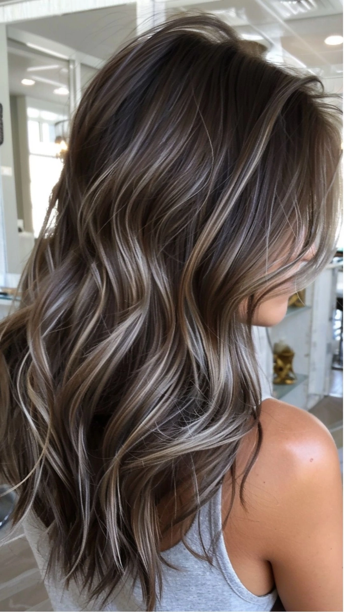 Party hairstyle with balayage color melt highlights for evening events Party hairstyle highlighting balayage color melts for a festive look