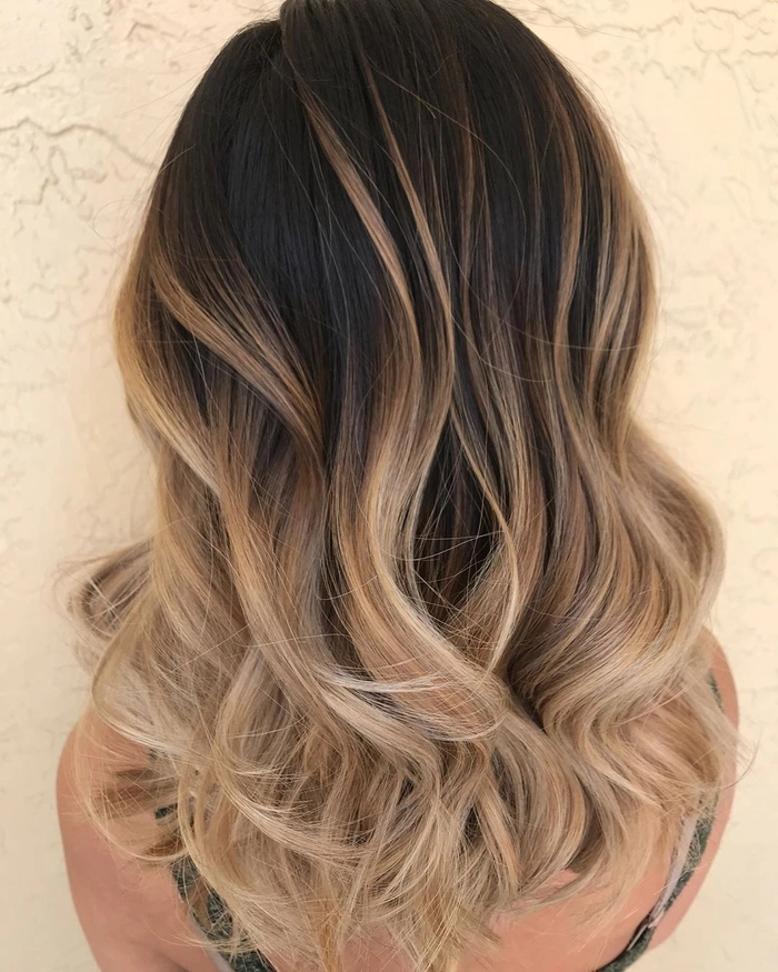 Party hairstyle highlighting balayage color melts for a glamorous event look Stunning party hairstyle with balayage color melts cascading in glossy waves