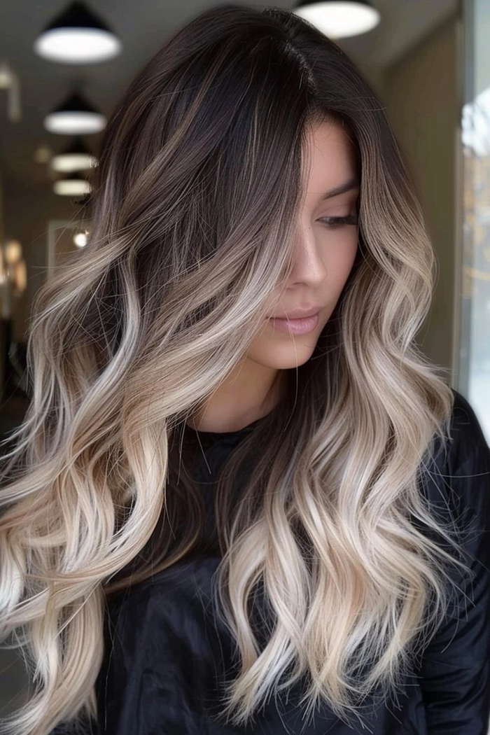 Balayage color melt hairstyle perfect for festive party occasions Elegant party hairstyle with a soft balayage color melt transition