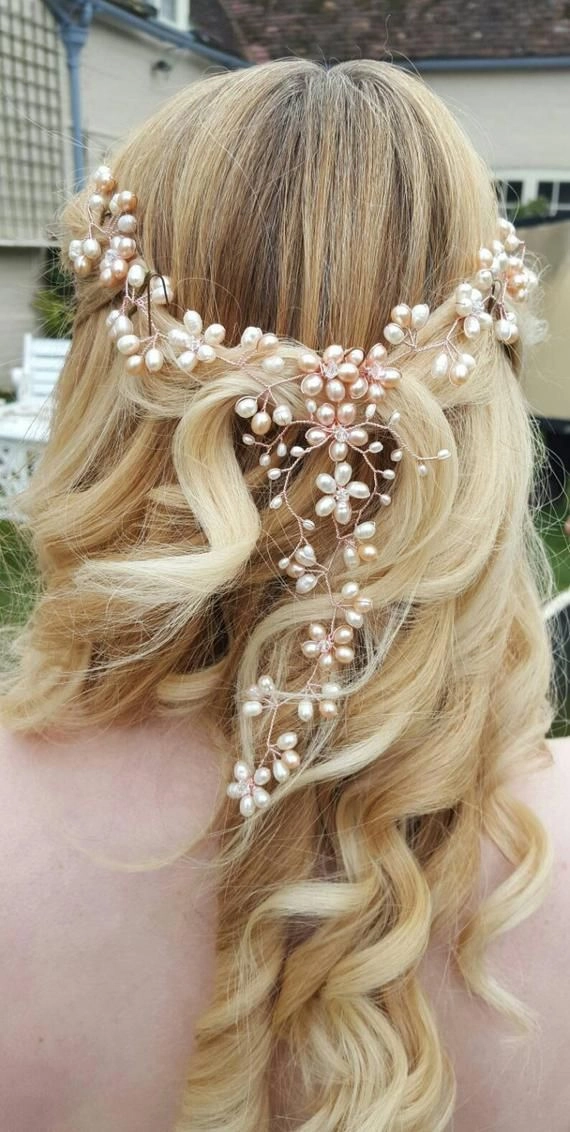 Updo with pearl hair vine cascade and loose curls
