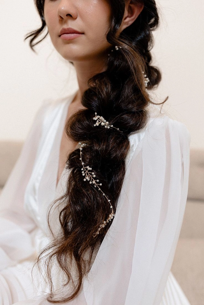 Elegant party updo adorned with pearl hair vines