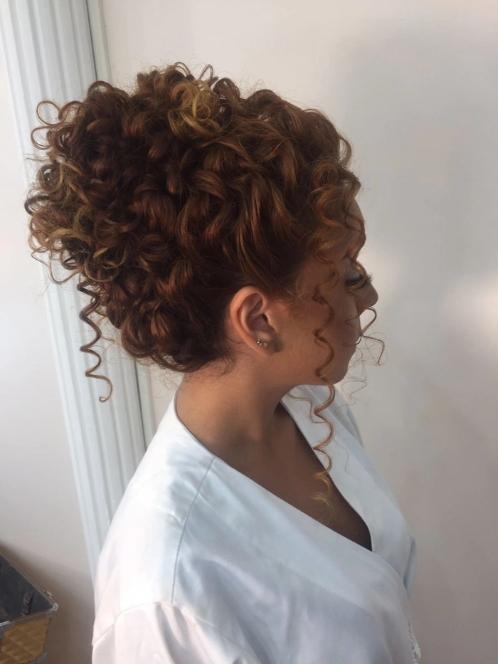 Elegant party updo featuring natural tight curls and delicate detailing Party updos for natural tight curl pattern hair with elegant twists