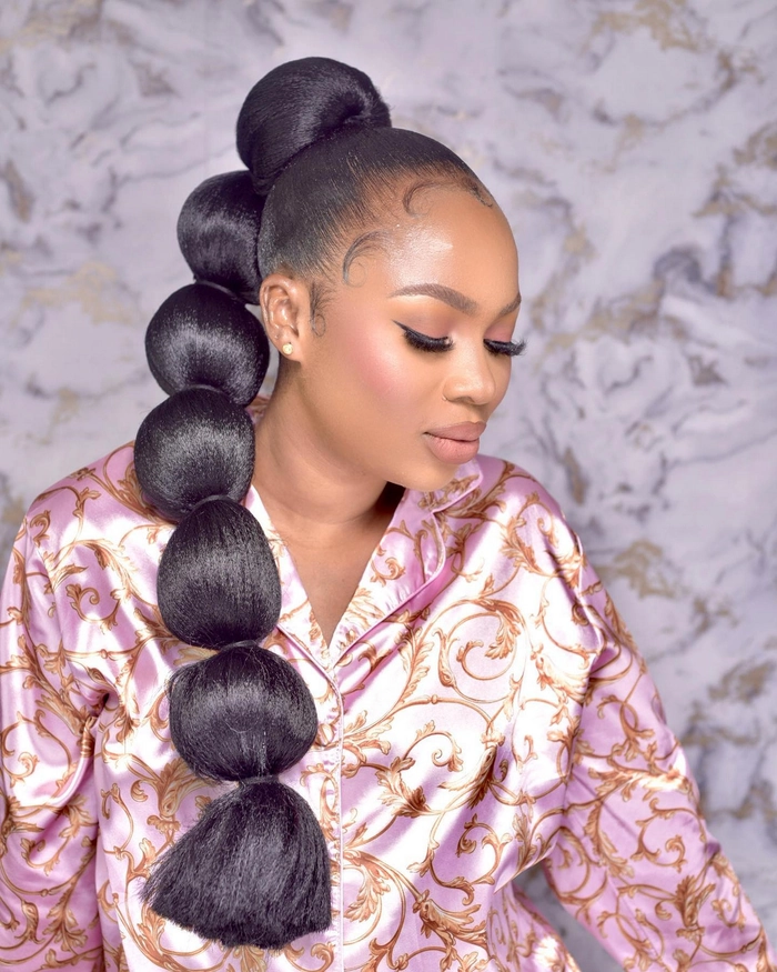 Modern prom bubble ponytail hairstyle for party occasions Prom bubble ponytail hairstyle with a modern twist for a party look