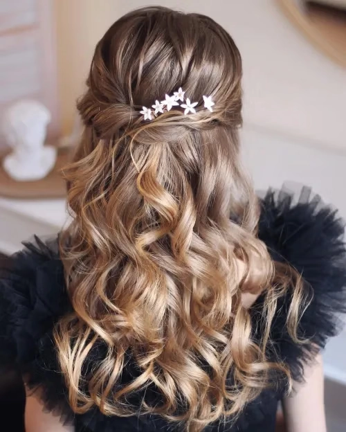 Elegant prom updo for high school senior with sparkling hair accessories