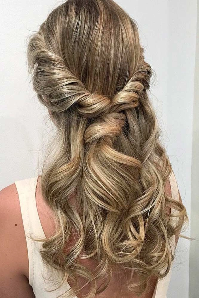 Elegant updo with soft curls for high school senior prom night