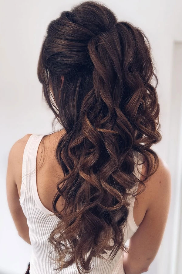 Elegant prom updo with sparkling accessories for high school senior party look