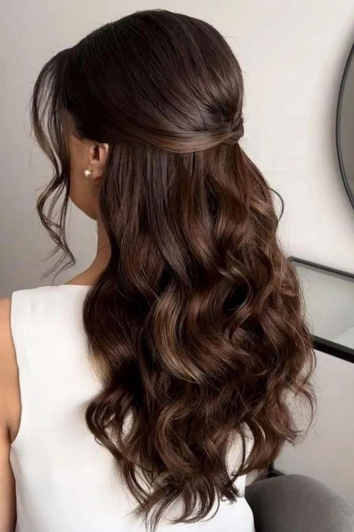 Prom Hairstyle Idea 10: Medium Wavy Hair with Romantic Curls for a Party Look Elegant prom hairstyle for medium wavy hair with soft curls and side-swept detail