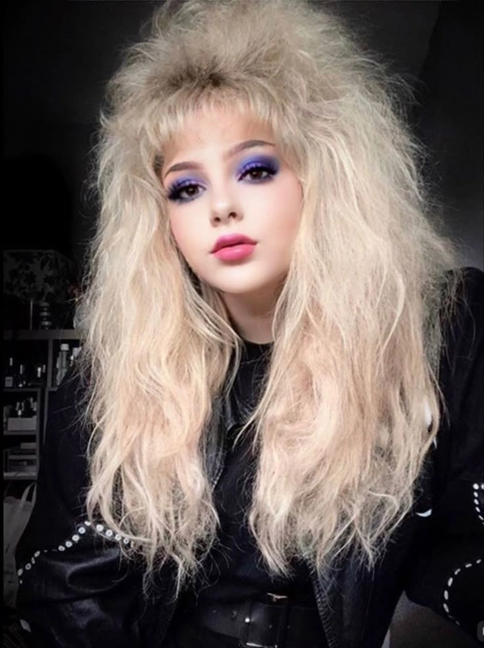 Retro eighties party hairstyle with high volume and big curls