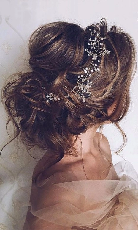 Spring prom floral accessorized updo for party hairstyles Elegant spring prom updo adorned with floral accessories