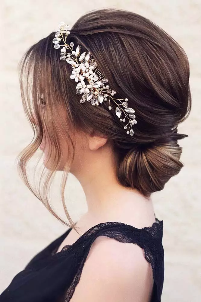 Floral accented updo for a spring prom party look Spring prom hairstyle featuring an elegant updo accessorized with fresh flowers