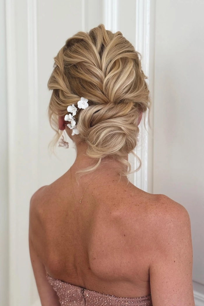 Spring Prom Floral Accessorized Updo – Party Hairstyle Inspiration Elegant spring prom updo adorned with fresh floral accessories and soft curls