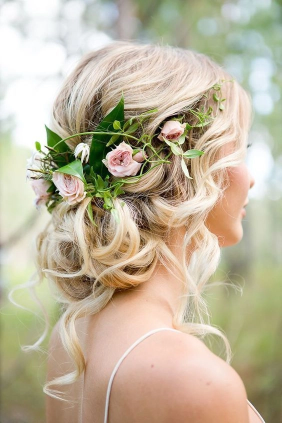 Spring prom floral accessorized updo hairstyle Elegant spring prom updo with floral accessories
