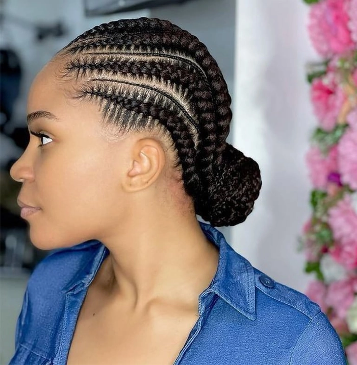 Summer party braids carefully styled to minimize visibility of thinning edges at a festive outdoor celebration