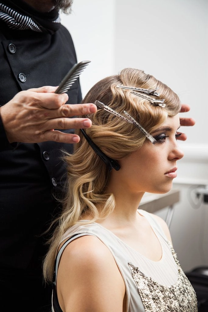 Vintage Great Gatsby party hairstyle with sculpted finger waves and a sparkly headband