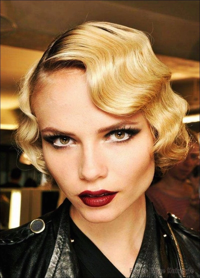 Elegant vintage Great Gatsby party hairstyle with sculpted finger waves and feathered headband