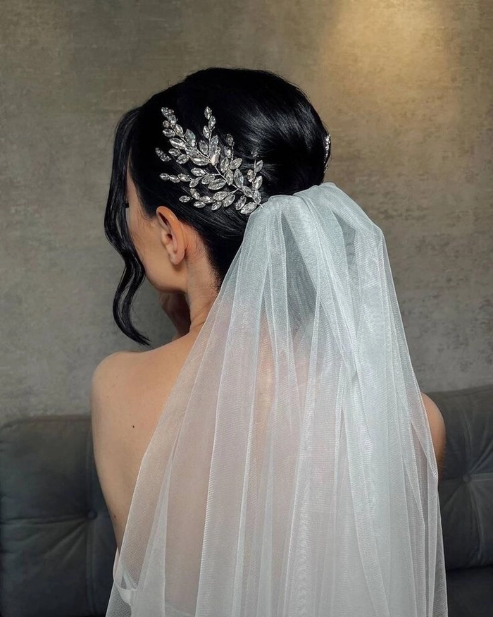 Elegant wedding guest hairstyle with crystal hairpins