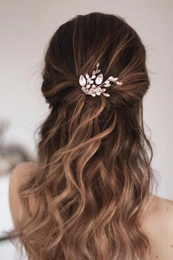 Elegant wedding guest hairstyle adorned with sparkling crystal hairpins