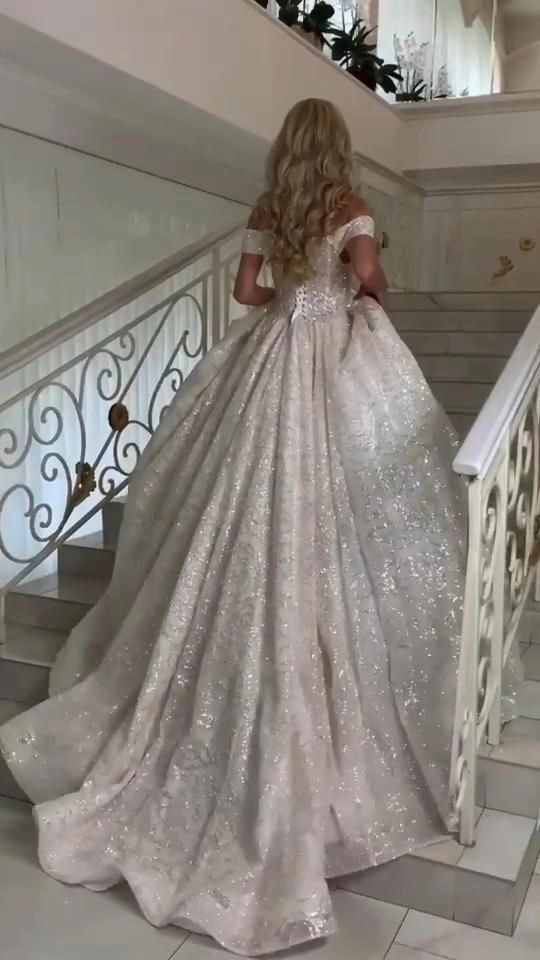 Elegant wedding guest updo paired with a heavy beaded formal gown for party hairstyles
