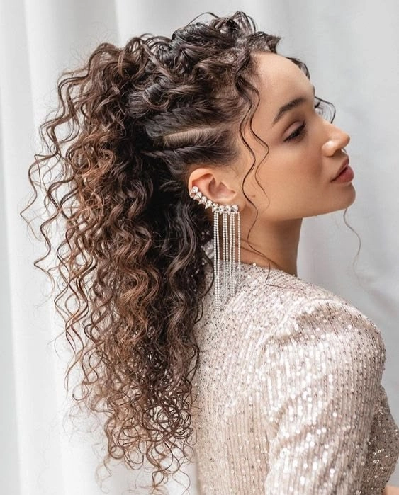 Medium curly hair styled for a winter gala party