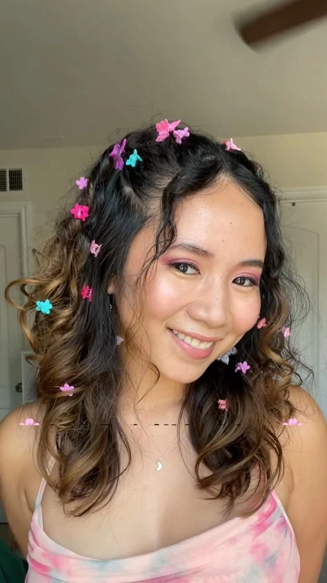 Y2K clubbing hairstyle with colorful butterfly clips