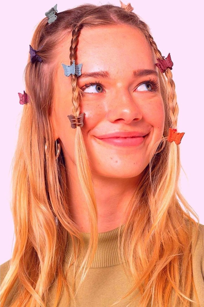 Y2K party hairstyle with colorful butterfly clips and voluminous waves for clubbing