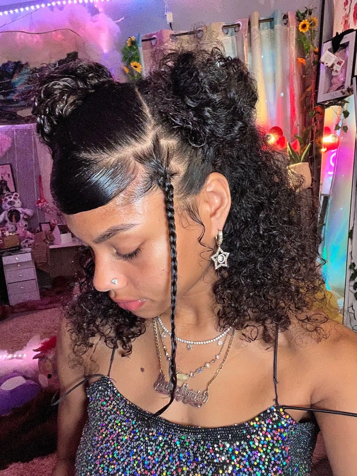 Model showing a y2k themed clubbing hairstyle decorated with butterfly clips