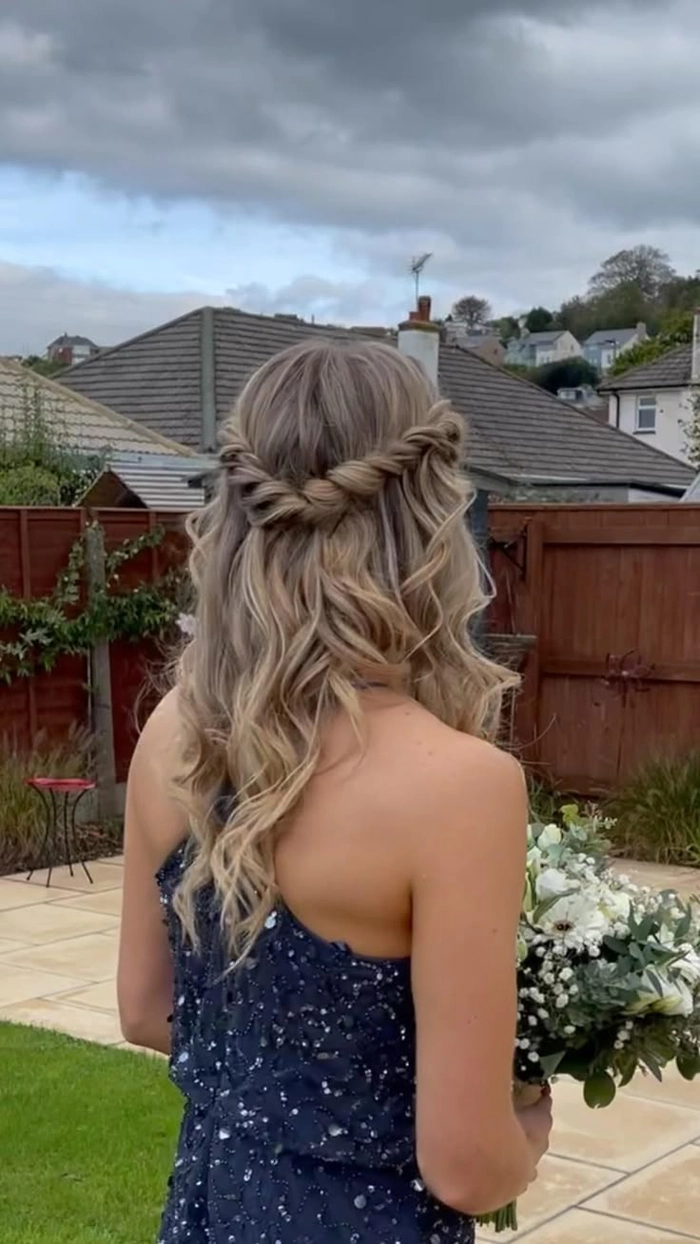 Boho chic prom hairstyle featuring loose waves and soft curls