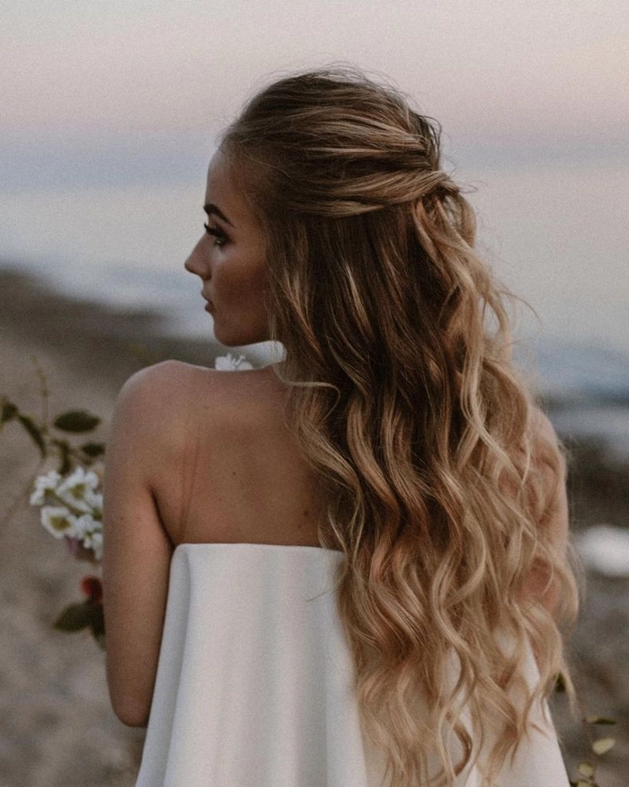 Boho chic prom hairstyle featuring elegant loose waves