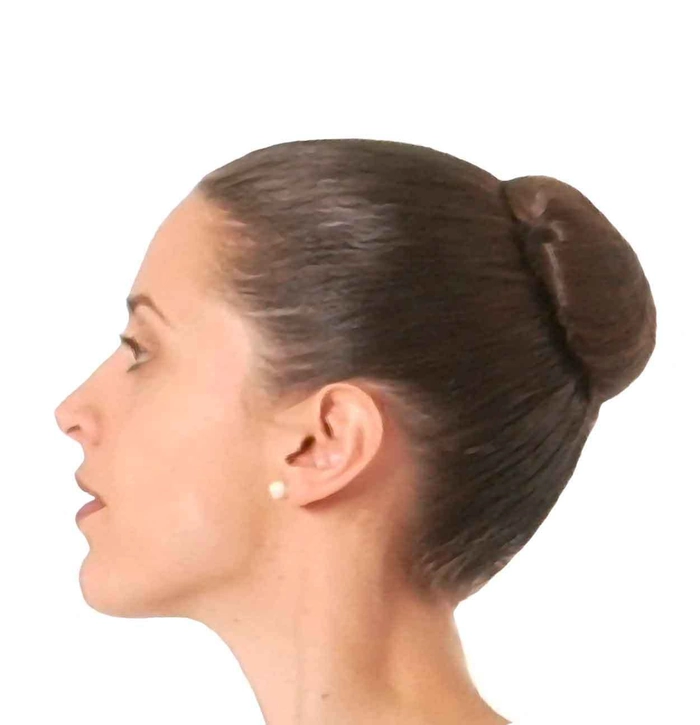 Sophisticated prom hairstyle featuring a timeless ballet bun look Elegant classic ballet bun prom hairstyle with adorned hairpins