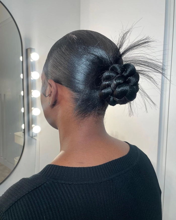 Timeless prom look featuring a classic ballet bun style Elegant classic ballet bun prom hairstyle with sleek finish