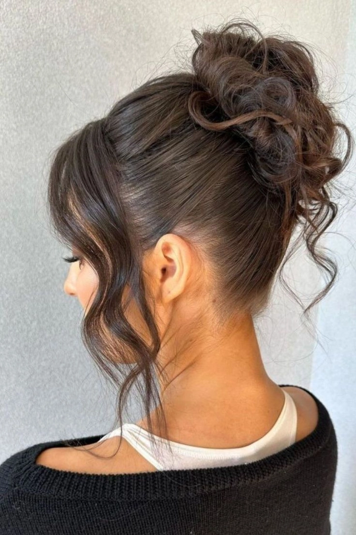 Timeless prom look featuring a sleek ballet bun for formal events Elegant classic ballet bun prom hairstyle with delicate hair accessories