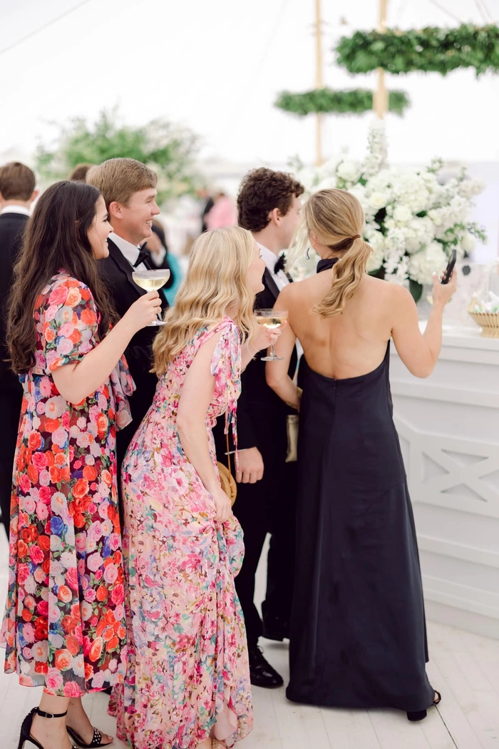 Chic prom hairstyle perfect for a sophisticated black tie optional event Elegant black tie optional prom hairstyle with soft curls and side sweep