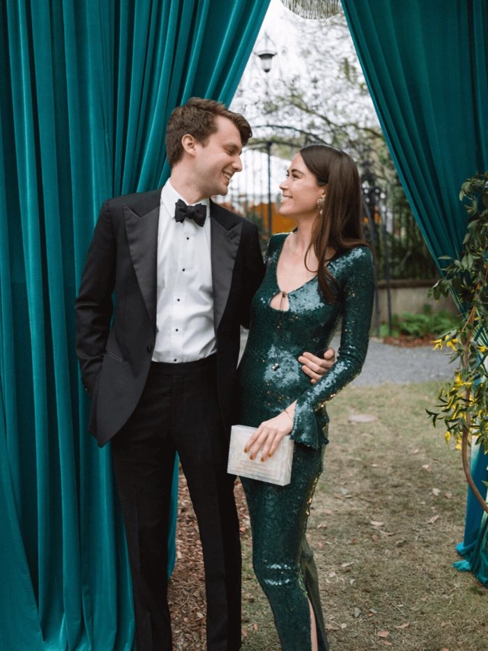 Chic prom hairstyle perfect for a black tie optional dress code event Elegant black tie optional prom hairstyle with soft curls and a sleek finish
