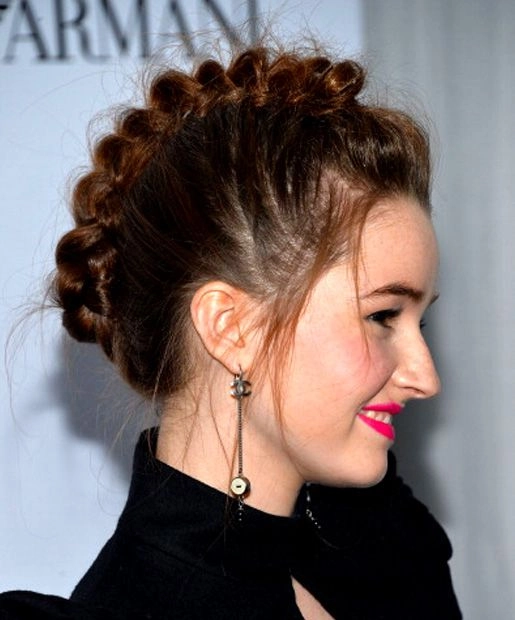 Elegant prom hairstyle featuring a braided mohawk with soft curls