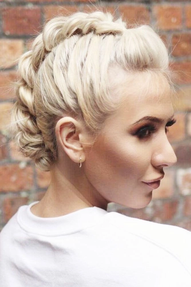 Elegant prom hairstyle featuring a braided mohawk with intricate twists and volume