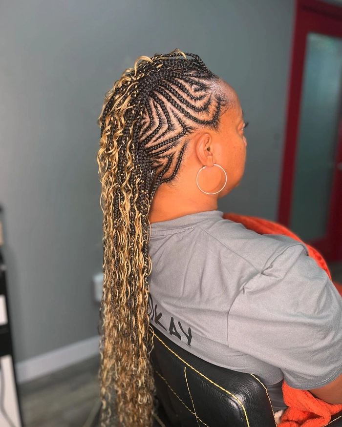 Elegant prom hairstyle featuring a braided mohawk with intricate twists and layers