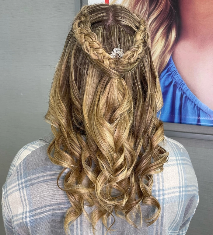 Elegant prom hairstyle featuring a braided mohawk with intricate details