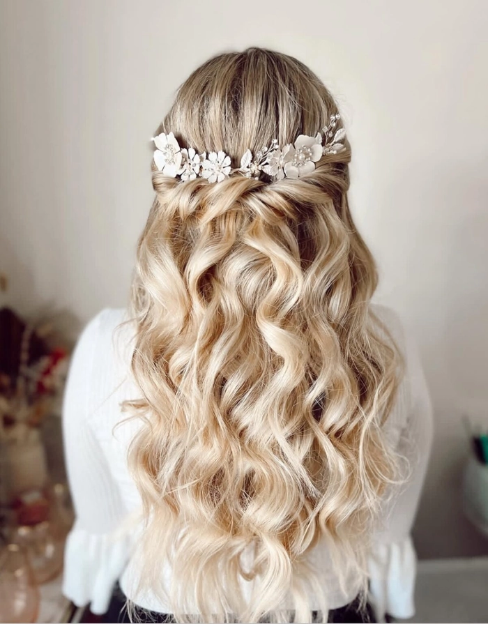 Elegant braided prom hairstyle perfect for a beach venue with soft waves and floral accents