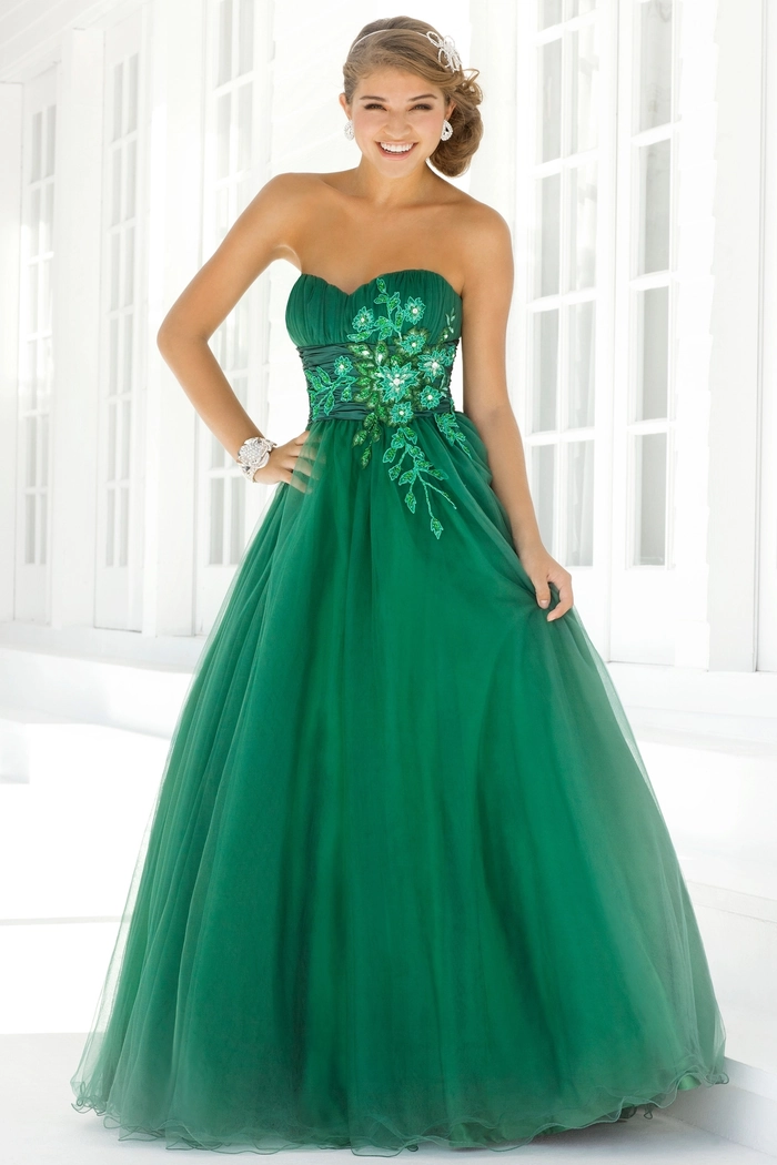 Elegant braided prom hairstyle perfectly complements a flowing green dress