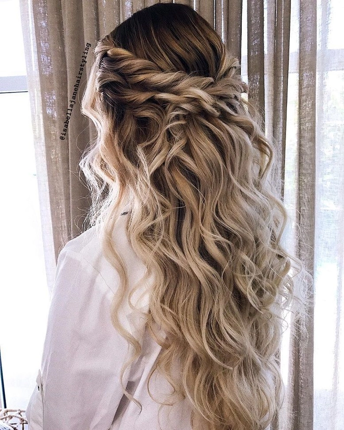 Elegant braided prom hairstyle perfect for a rustic barn venue setting