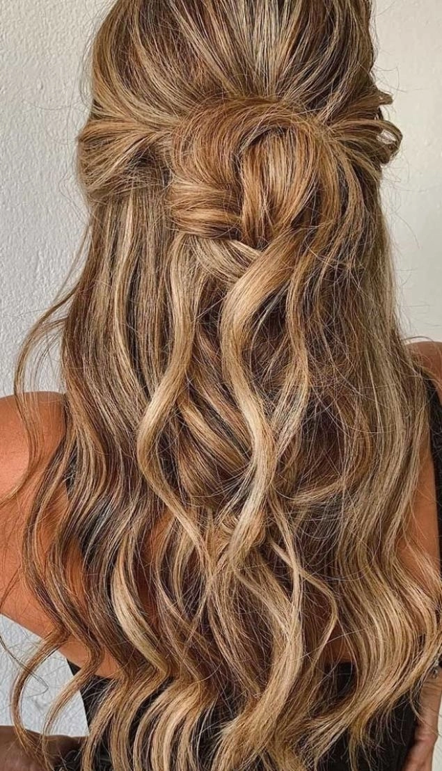 Elegant braided updo perfect for prom hairstyles at a rustic barn venue