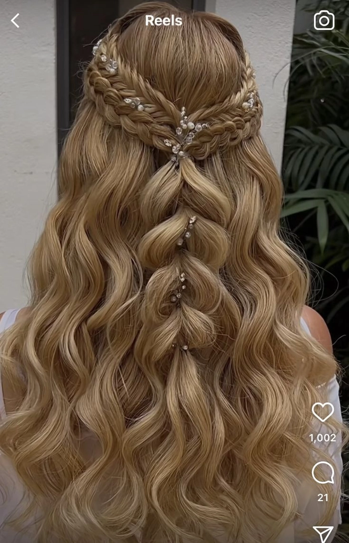 Elegant braided updo styled for prom at a rustic barn venue