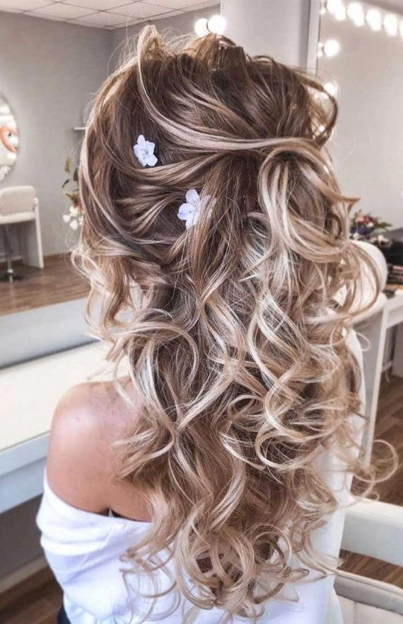 Elegant braided updo perfect for prom hairstyles at a rustic barn venue