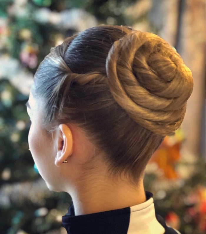 Sophisticated prom hairstyle featuring a timeless ballet bun Elegant classic ballet bun perfect for prom hairstyles