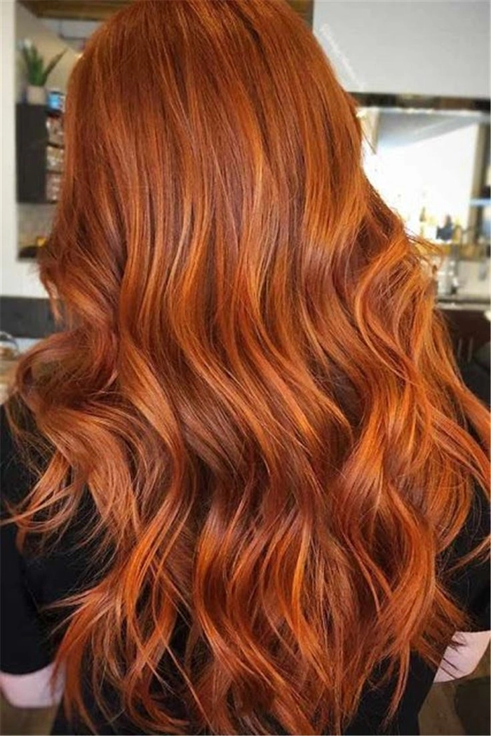 Elegant prom hairstyle showcasing copper ginger hair with soft curls