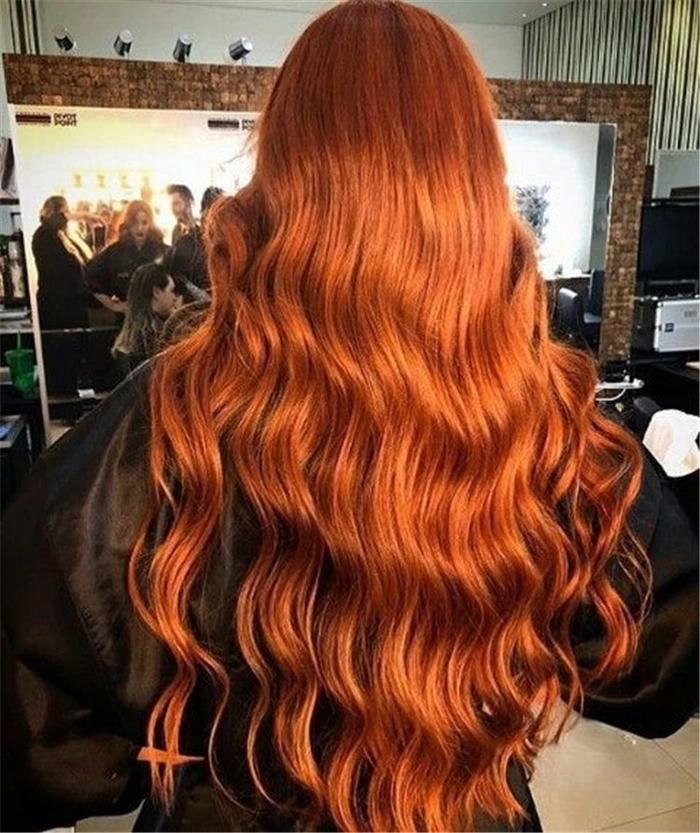 Elegant prom hairstyle showcasing vibrant copper ginger hair with intricate curls