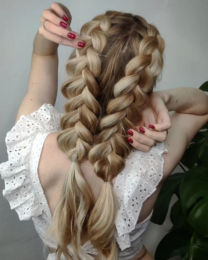 Beautifully styled prom look highlighting a Dutch braid for a sophisticated vibe Elegant prom hairstyle featuring a Dutch braid intertwined with loose curls